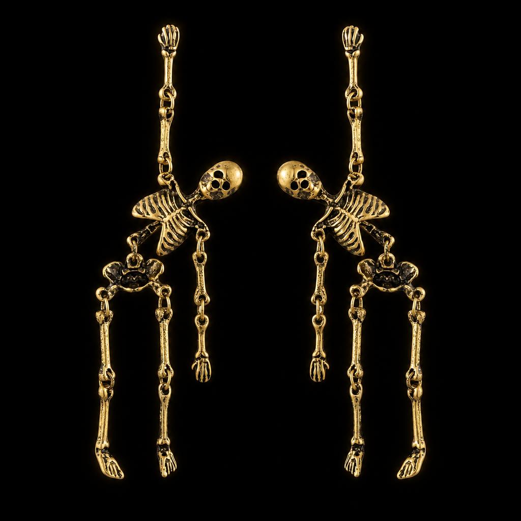 Skeleton dangle earrings in antiqued gold, shown as a pair on black
